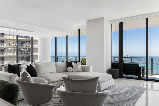 650 NE 32nd St Unit Ph5004, Miami, FL 33137 - living room with floor to ceiling windows, a water view, healthy amount of natural light, and a chandelier