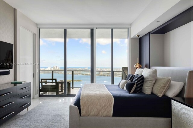 650 NE 32nd St Unit Ph5004, Miami, FL 33137 - bedroom with a water view, floor to ceiling windows, and access to exterior