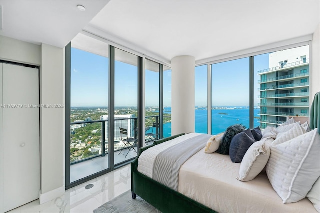 650 NE 32nd St Unit Ph5004, Miami, FL 33137 - bedroom with floor to ceiling windows, marble finish floors, and a water view