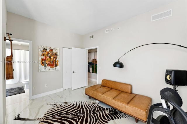 650 NE 32nd St Unit Ph5004, Miami, FL 33137 - living area featuring marble look tiles and baseboards