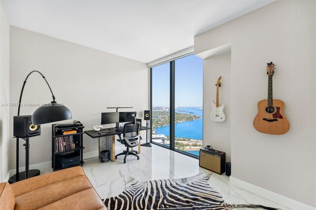 650 NE 32nd St Unit Ph5004, Miami, FL 33137 - home office with marble tiled floors, floor to ceiling windows, and baseboards