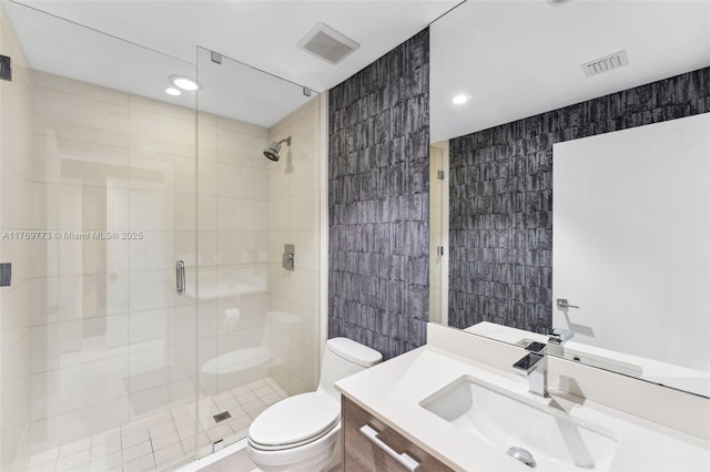650 NE 32nd St Unit Ph5004, Miami, FL 33137 - bathroom featuring tile walls, toilet, a stall shower, vanity, and recessed lighting