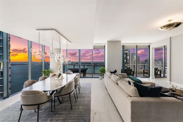 650 NE 32nd St Unit Ph5004, Miami, FL 33137 - dining room featuring marble finish flooring and a wall of windows