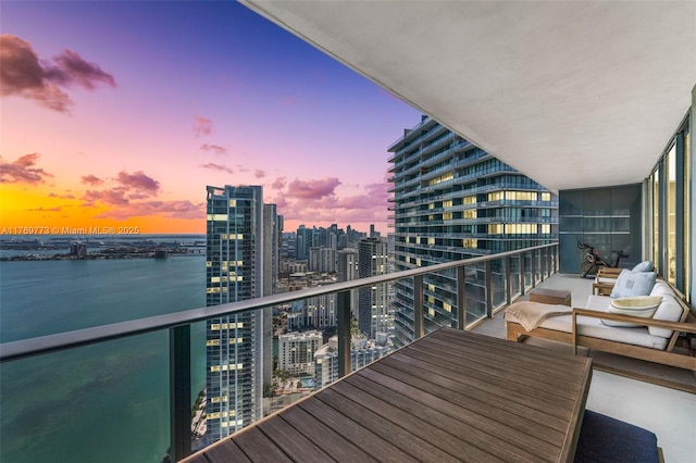650 NE 32nd St Unit Ph5004, Miami, FL 33137 - balcony at dusk with a city view and a water view