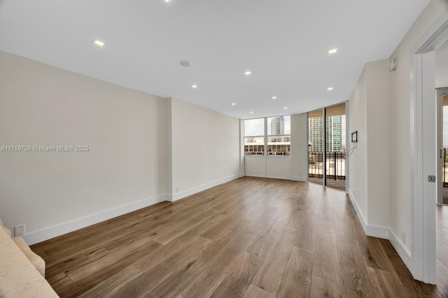 1901 Brickell Ave Unit B2304, Miami, FL 33129 - unfurnished living room with wood finished floors and recessed lighting