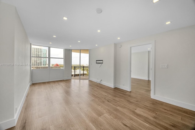 1901 Brickell Ave Unit B2304, Miami, FL 33129 - empty room with light wood-style floors and recessed lighting