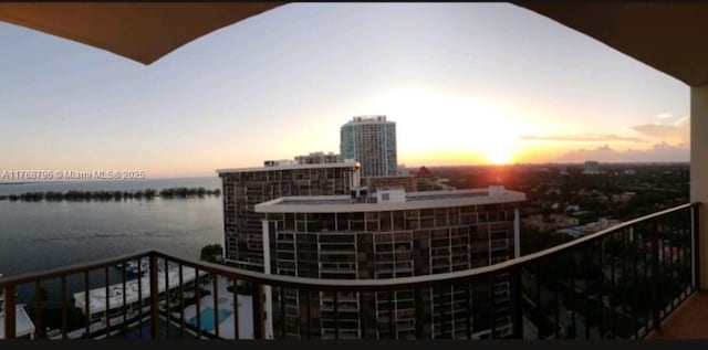 1901 Brickell Ave Unit B2304, Miami, FL 33129 - balcony at dusk featuring a water view and a view of city
