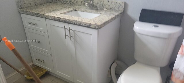 840 NE 32nd Ct, Pompano Beach, FL 33064 - half bathroom featuring toilet, vanity, and tile patterned floors