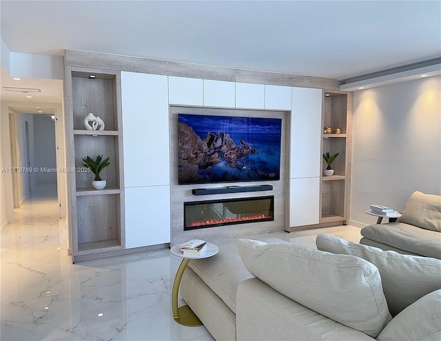 19707 Turnberry Way Unit 6E, Aventura, FL 33180 - living area featuring built in features, marble finish floor, and a glass covered fireplace