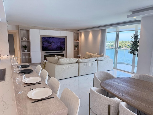 19707 Turnberry Way Unit 6E, Aventura, FL 33180 - living room featuring marble finish floor and built in shelves