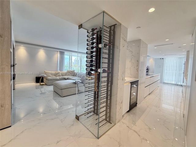 19707 Turnberry Way Unit 6E, Aventura, FL 33180 - wine area featuring marble finish floor, wine cooler, and recessed lighting
