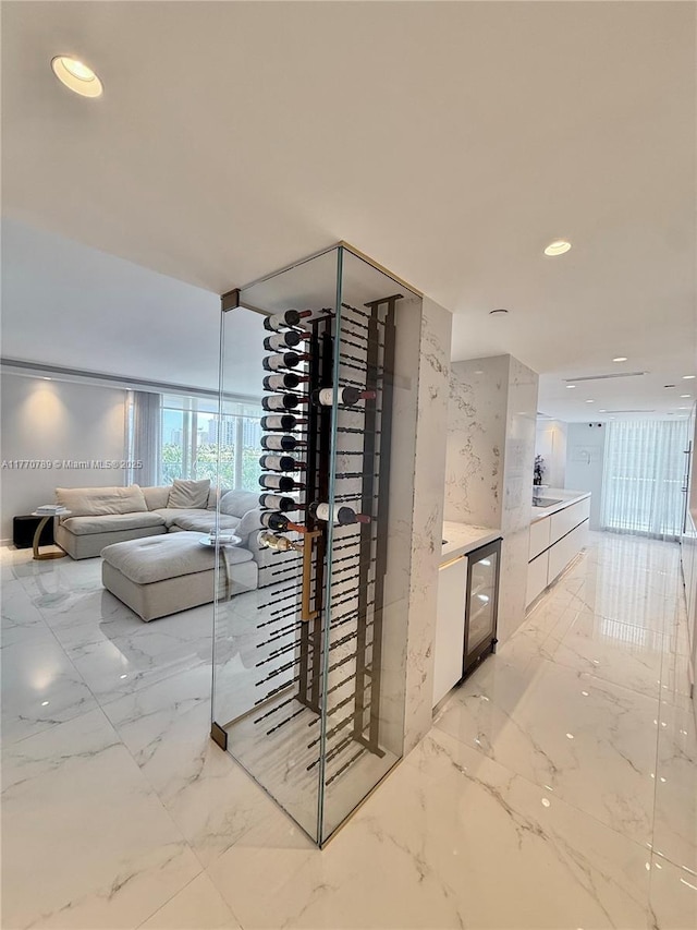 19707 Turnberry Way Unit 6E, Aventura, FL 33180 - wine area featuring marble finish floor, stone wall, and recessed lighting