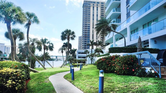 19707 Turnberry Way Unit 6E, Aventura, FL 33180 - surrounding community featuring a lawn and a water view