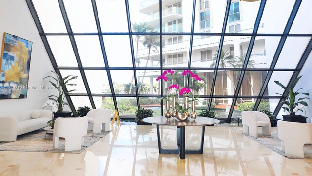 19707 Turnberry Way Unit 6E, Aventura, FL 33180 - living area with a wall of windows