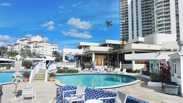 19707 Turnberry Way Unit 6E, Aventura, FL 33180 - community pool featuring a patio