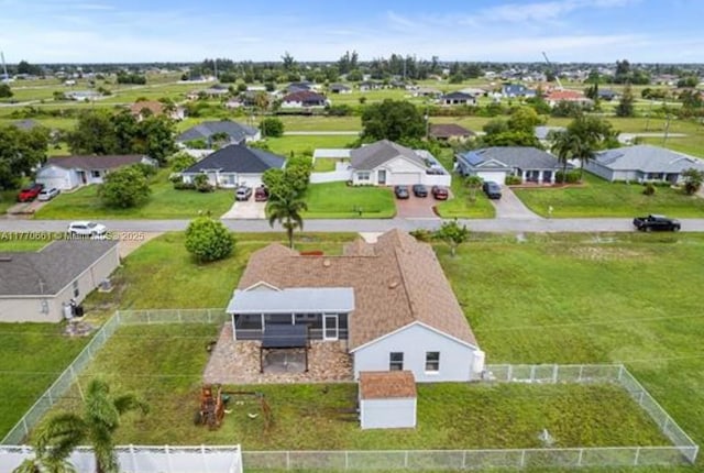 1715 NE 2nd Ave, Cape Coral, FL 33909 - aerial perspective of suburban area