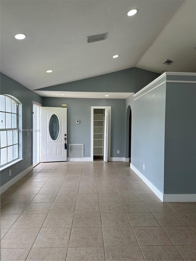 1715 NE 2nd Ave, Cape Coral, FL 33909 - tiled entrance foyer featuring arched walkways, vaulted ceiling, baseboards, and recessed lighting