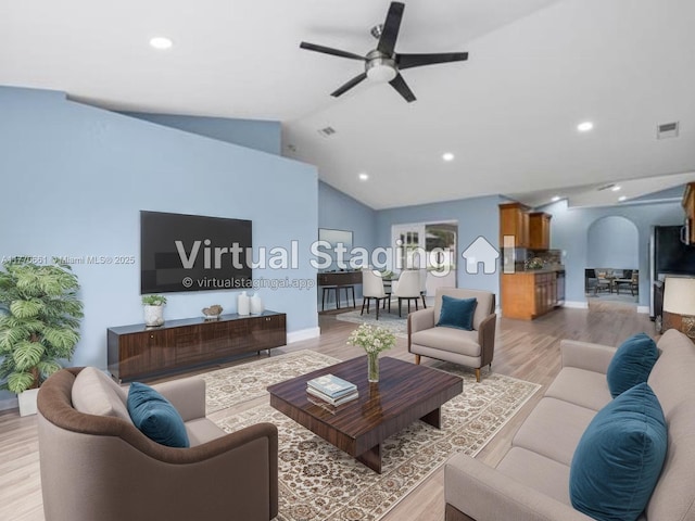 1715 NE 2nd Ave, Cape Coral, FL 33909 - living room featuring light wood-type flooring, ceiling fan, recessed lighting, lofted ceiling, and baseboards