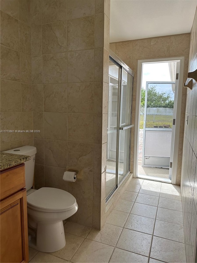 1715 NE 2nd Ave, Cape Coral, FL 33909 - full bath with a stall shower, tile walls, toilet, vanity, and tile patterned floors