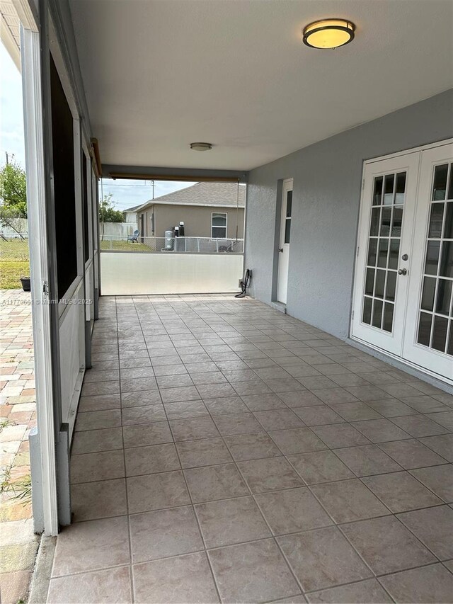 1715 NE 2nd Ave, Cape Coral, FL 33909 - view of patio / terrace featuring french doors