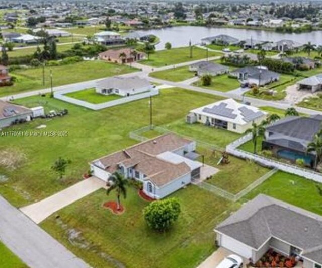 1715 NE 2nd Ave, Cape Coral, FL 33909 - aerial perspective of suburban area with a nearby body of water