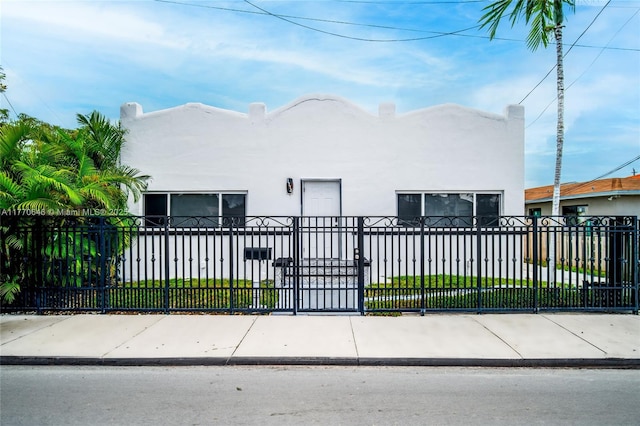 1114 SW 11th Ave, Miami, FL 33129 - view of front of property featuring stucco siding and a fenced front yard