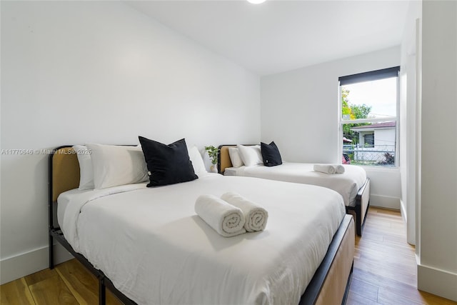 1114 SW 11th Ave, Miami, FL 33129 - bedroom featuring light wood-type flooring and baseboards