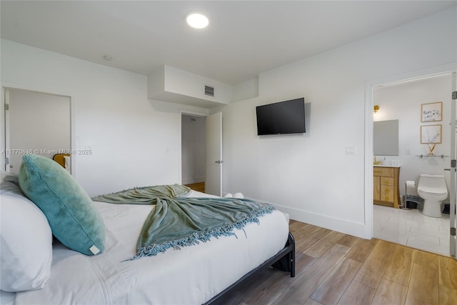 1114 SW 11th Ave, Miami, FL 33129 - bedroom featuring light wood finished floors and ensuite bathroom
