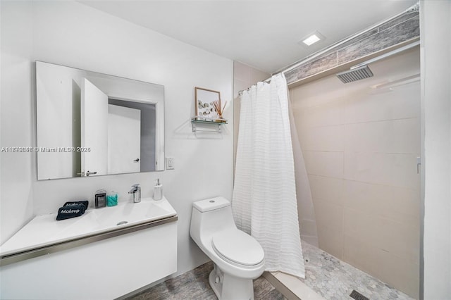 full bath with a tile shower, toilet, vanity, wood finished floors, and visible vents