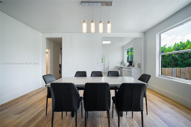 1114 SW 11th Ave, Miami, FL 33129 - dining space featuring baseboards and light wood-style flooring