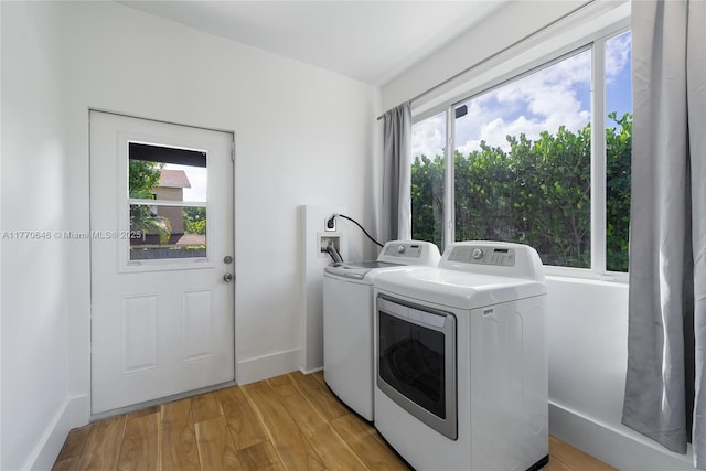 1114 SW 11th Ave, Miami, FL 33129 - washroom with washer and dryer, plenty of natural light, and light wood-type flooring