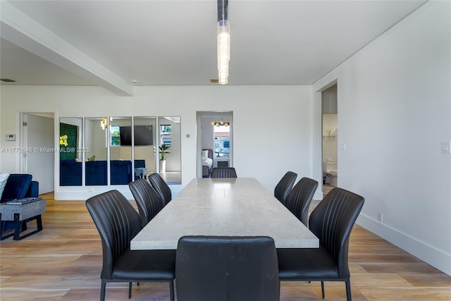 1114 SW 11th Ave, Miami, FL 33129 - dining area featuring light wood-style flooring and healthy amount of natural light