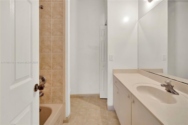 full bathroom with tile patterned floors, vanity, and washtub / shower combination