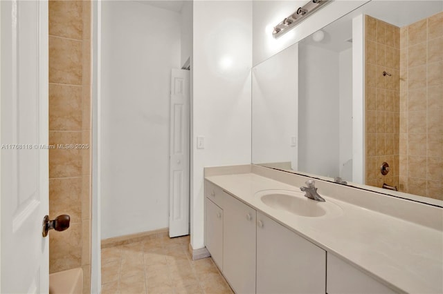 bathroom with tile patterned floors, vanity, baseboards, and bathtub / shower combination