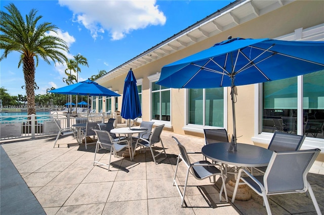 374 NE 27th Ave Unit 203, Homestead, FL 33033 - view of patio with outdoor dining space