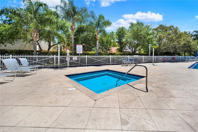 374 NE 27th Ave Unit 203, Homestead, FL 33033 - view of swimming pool with a patio area, fence, and a swimming pool