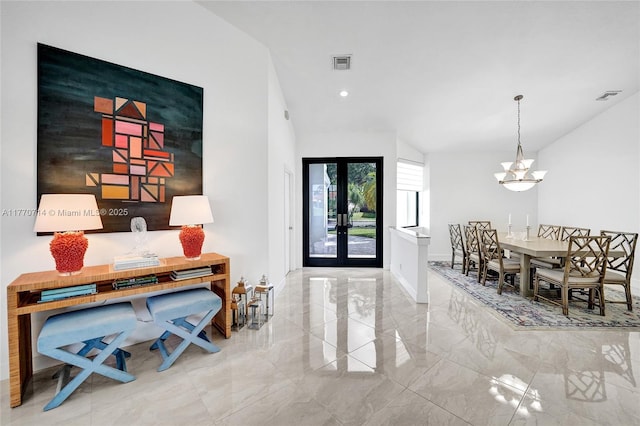 2649 Nelson Ct, Weston, FL 33332 - entrance foyer featuring marble tiled floors, a chandelier, vaulted ceiling, french doors, and recessed lighting