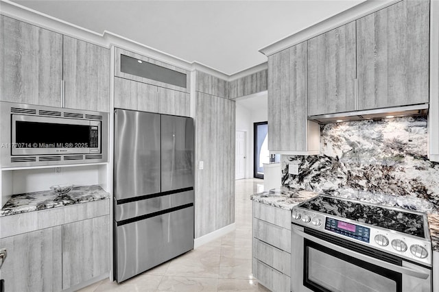 2649 Nelson Ct, Weston, FL 33332 - kitchen featuring appliances with stainless steel finishes, extractor fan, modern cabinets, light stone counters, and light marble finish flooring