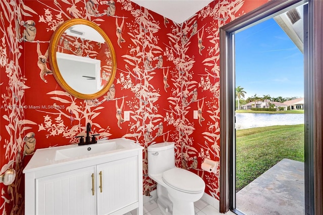 2649 Nelson Ct, Weston, FL 33332 - half bathroom with wallpapered walls, a water view, vanity, and tile patterned flooring
