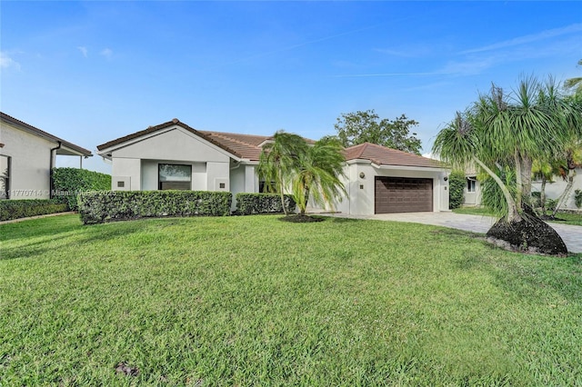 2649 Nelson Ct, Weston, FL 33332 - view of front of property featuring a garage, stucco siding, a front lawn, driveway, and a tiled roof