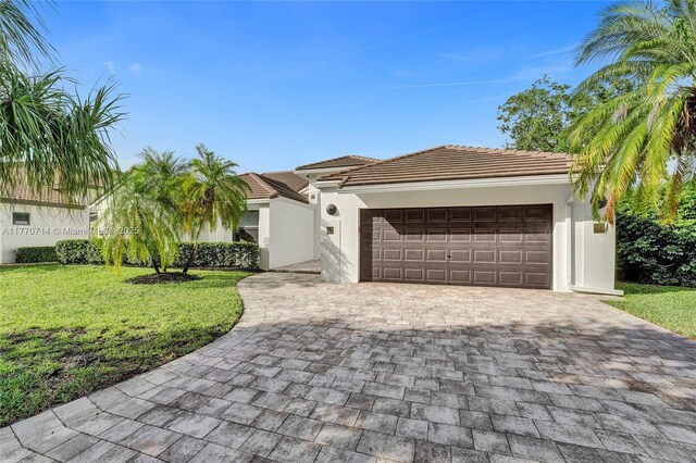 2649 Nelson Ct, Weston, FL 33332 - view of front facade featuring a front lawn, stucco siding, decorative driveway, and a garage