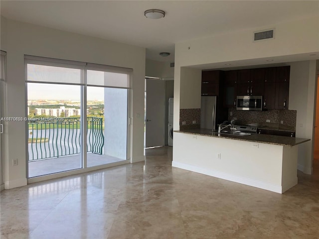 20000 E Country Club Dr Unit Ts02, Aventura, FL 33180 - kitchen with modern cabinets, visible vents, a sink, stainless steel appliances, and decorative backsplash
