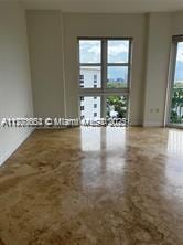 20000 E Country Club Dr Unit Ts02, Aventura, FL 33180 - spare room featuring plenty of natural light