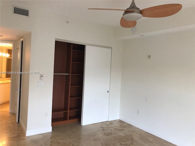20000 E Country Club Dr Unit Ts02, Aventura, FL 33180 - unfurnished bedroom featuring concrete floors, visible vents, baseboards, a closet, and ceiling fan