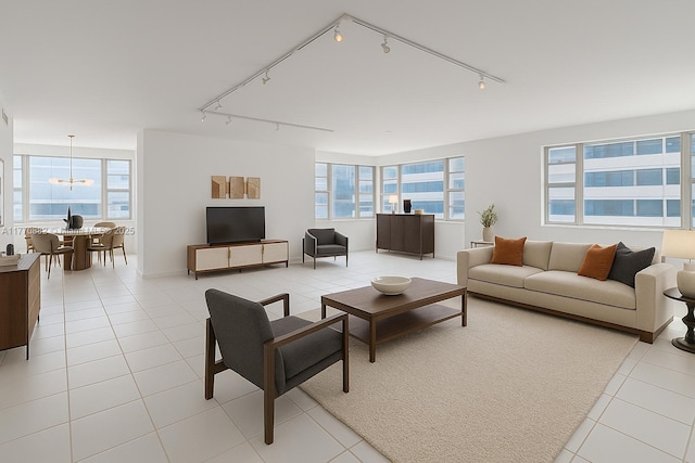 5255 Collins Ave Unit 5D, Miami Beach, FL 33140 - living area with track lighting, a chandelier, and light tile patterned flooring