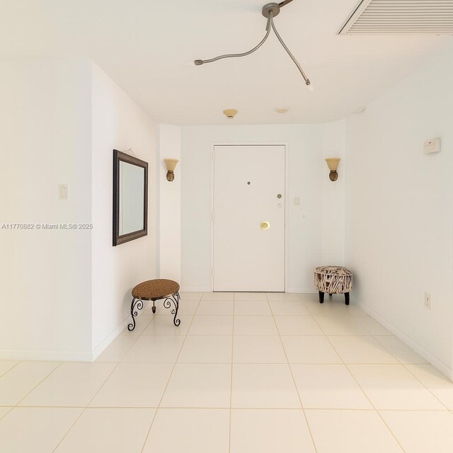 5255 Collins Ave Unit 5D, Miami Beach, FL 33140 - hall with tile patterned flooring and baseboards