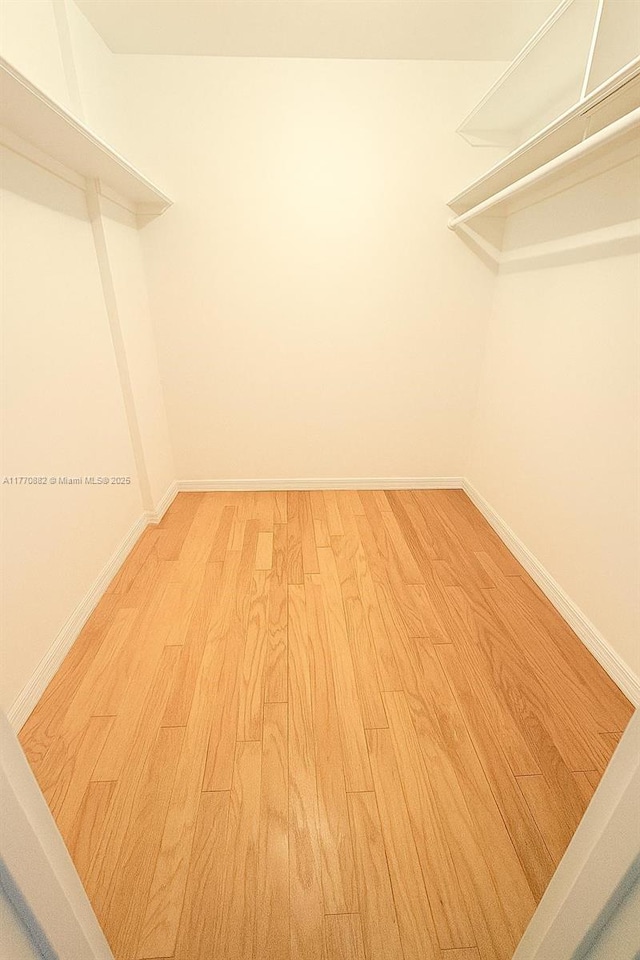 5255 Collins Ave Unit 5D, Miami Beach, FL 33140 - walk in closet with light wood finished floors