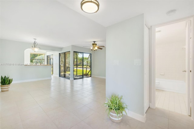 1111 Adams Ave Unit 1111B, Homestead, FL 33034 - empty room featuring a ceiling fan, light tile patterned floors, and baseboards
