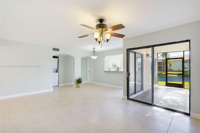 1111 Adams Ave Unit 1111B, Homestead, FL 33034 - empty room with arched walkways, baseboards, visible vents, and a ceiling fan