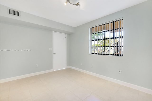 1111 Adams Ave Unit 1111B, Homestead, FL 33034 - spare room with baseboards and visible vents
